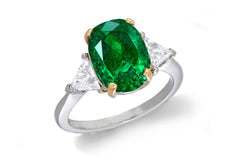 685 custom made unique oval emerald center stone and trillion diamond accent three stone engagement ring