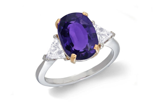 685 custom made unique oval purple sapphire center stone and trillion diamond accent three stone engagement ring