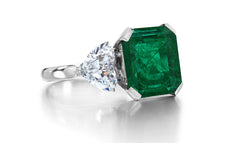 688 custom made unique emerald cut emerald enter stone and heart diamond accent three stone engagement ring