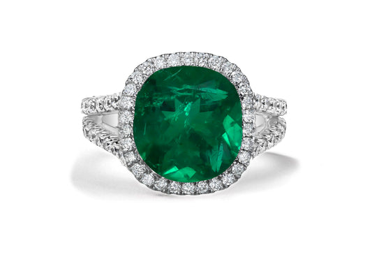 7 custom made emerald and diamond vintage halo engagement rings