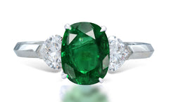 7 custom made unique oval emerald center stone with heart diamond accents three stone engagement ring