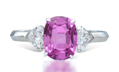 7 custom made unique oval pink sapphire center stone with heart diamond accents three stone engagement ring