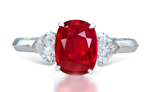 7 custom made unique oval ruby center stone with heart diamond accents three stone engagement ring