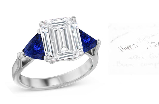 70 custom made unique emerald cut diamond center stone and trillion cut blue sapphire accent three stone engagement ring