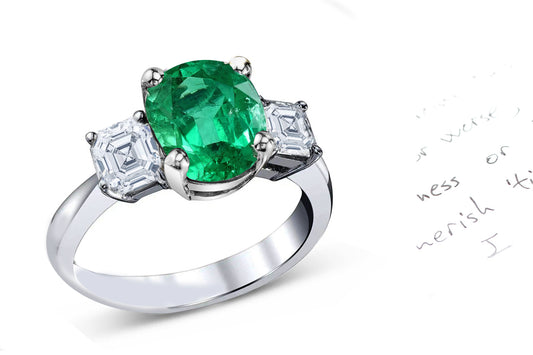 74 custom made unique oval cut emerald center stone and asscher cut diamond accent three stone engagement ring