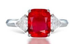 8 custom made unique cushion ruby center stone with trillion diamond accents three stone engagement ring