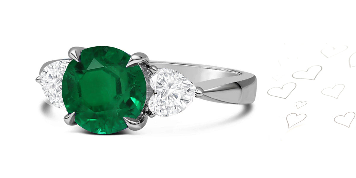 80 custom made unique round emerald and heart diamonde side three stone engagement ring