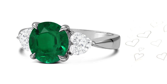 80 custom made unique round emerald and heart diamonde side three stone engagement ring