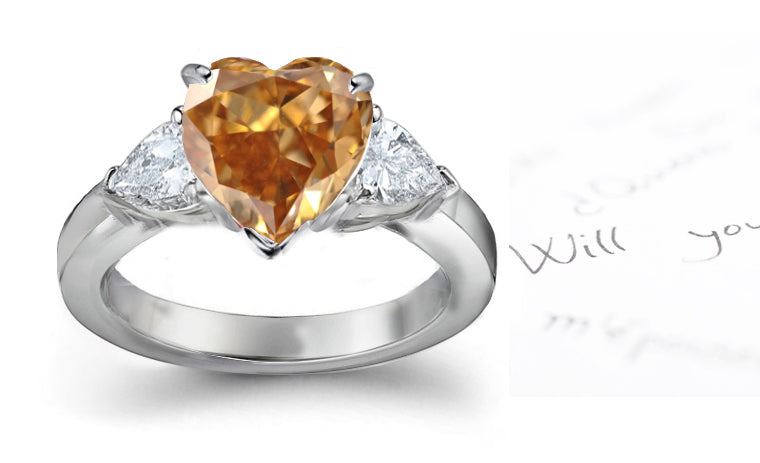 engagement ring three stone with fancy heart brown diamond center and trillion diamond sides