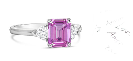 82 custom made unique emerald cut pink sapphire and heart diamond side three stone engagement ring