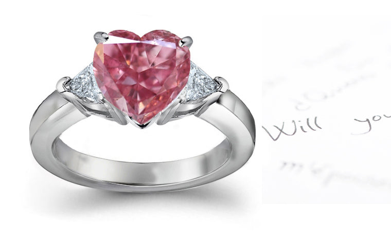 engagement ring three stone with fancy pink diamond center and trillion diamond sides