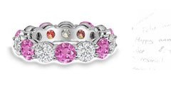 88 custom made unique stackable alternating round pink sapphire and diamond prong set eternity ring