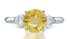 9 custom made unique round yellow sapphire center stone with heart diamond accents three stone engagement ring