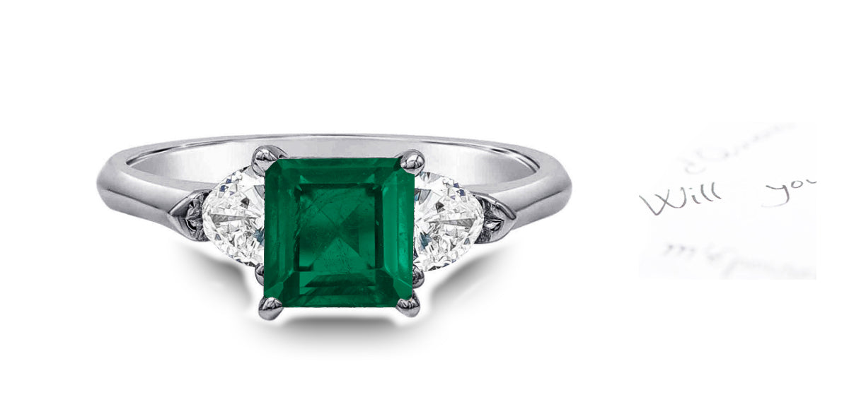 94 custom made unique square emerald and heart diamond side three stone engagement ring