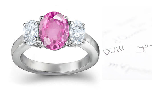 engagement ring three stone with oval pink sapphire and side oval diamonds