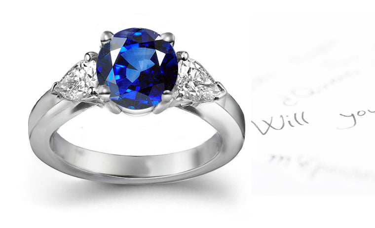 engagement ring three stone with round blue sapphire and trillion diamonds