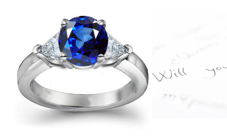 engagement ring three stone with round blue sapphire and side trillion diamonds