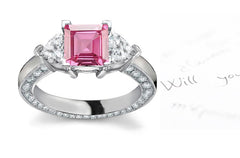 engagement ring with square pink sapphire center and diamond accents band