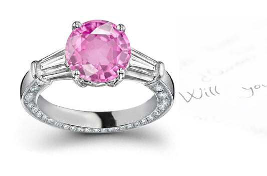 engagement ring with round pink sapphire center and diamond accents band