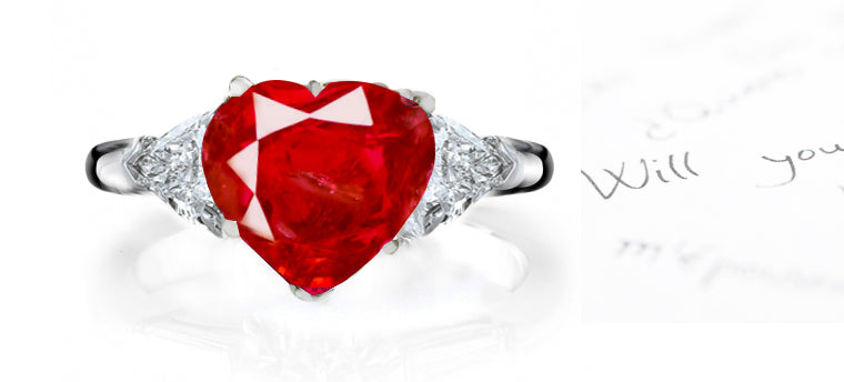 engagement ring three stone with heart ruby center and side trillion diamonds