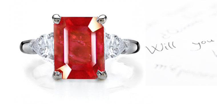 engagement ring three stone with emerald cut ruby center and side trillion diamonds