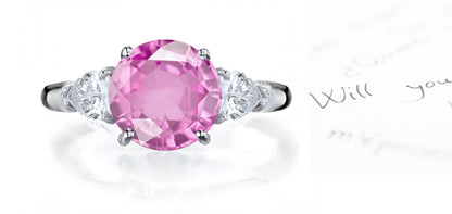 engagement ring three stone with round pink sapphire and side pear diamonds