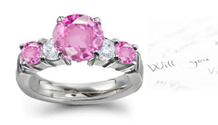 anniversary ring with five alternating round pink sapphires and diamonds