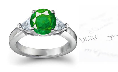 engagement ring three stone with round emerald center and side trillion diamonds