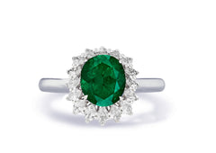 Custom made antique vintage inspired emerald and diamond halo engagement rings 1