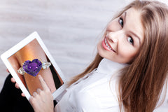 Custom made purple sapphire and diamond three stone engagement rings