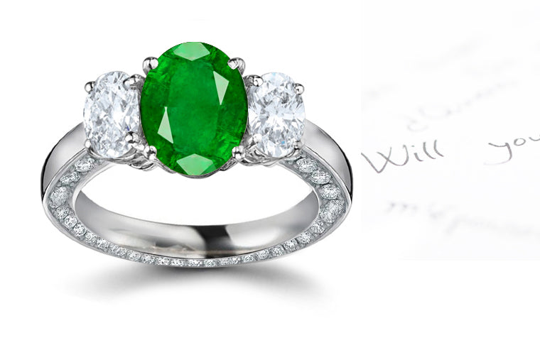 engagement ring three stone with oval emerald center and side oval diamonds