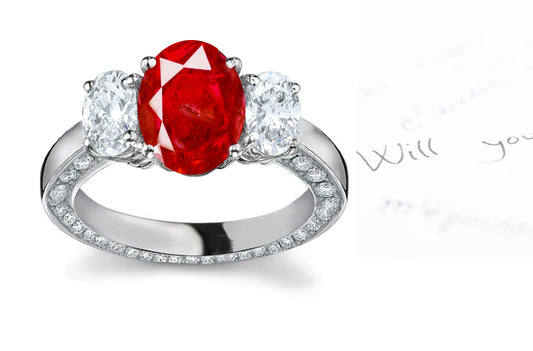 engagement ring three stove with oval ruby center and side oval diamonds