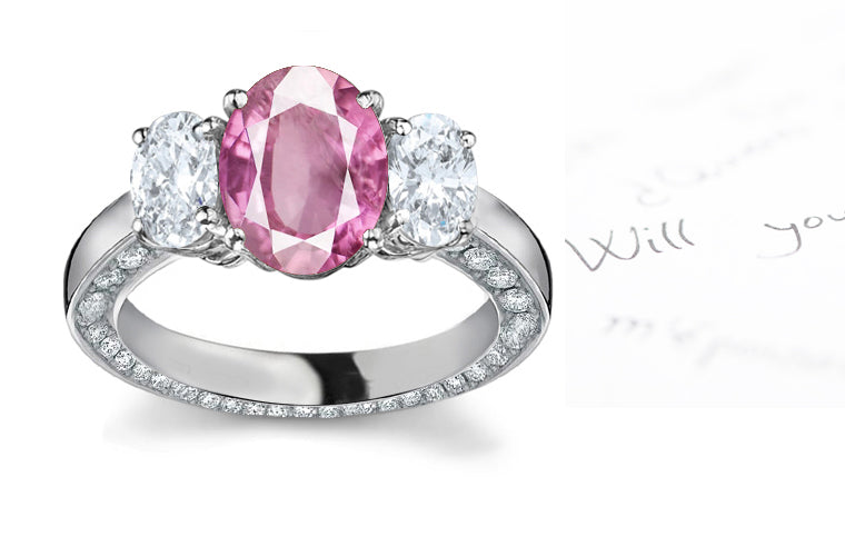 engagement ring three stone with oval pink sapphire center and side oval diamonds