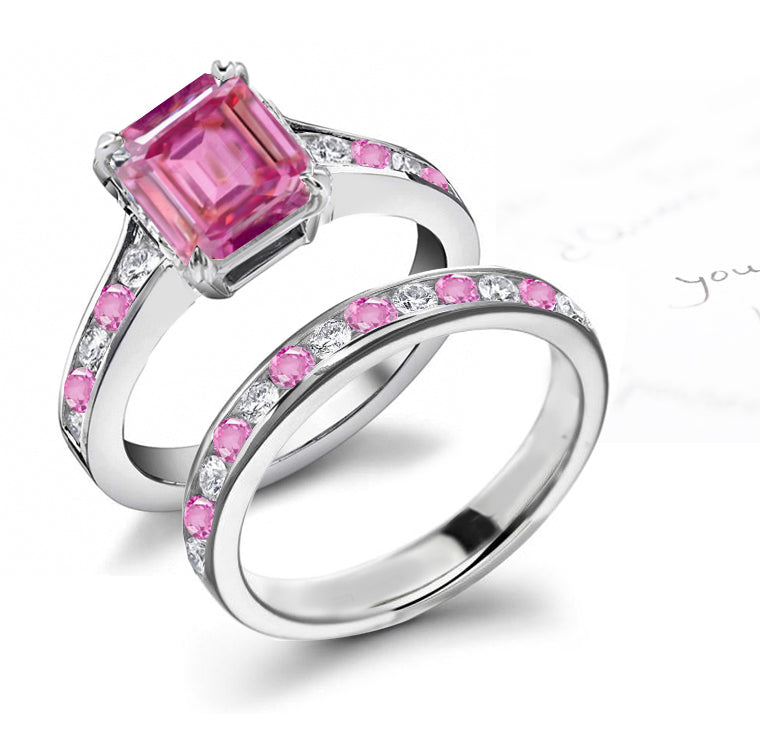 bridal set handcrafted with emerald cut pink sapphire center and band with alternating round pink sapphires and diamonds