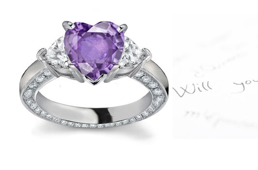 engagement ring handcrafted with heart purple sapphire center and side heart diamonds