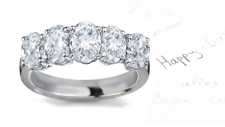 anniversary ring five stone prong set with oval diamonds