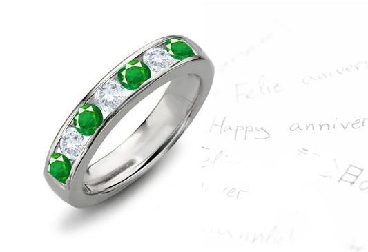 Anniversary ring with 7 alternating round emeralds and diamonds