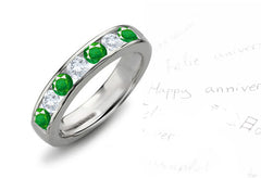 Anniversary ring with 7 alternating round emeralds and diamonds