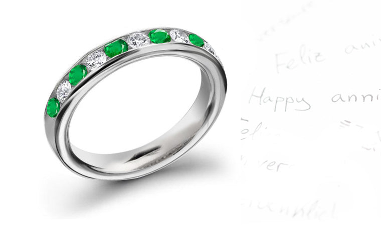 anniversary ring with alternating nine round emeralds and diamonds