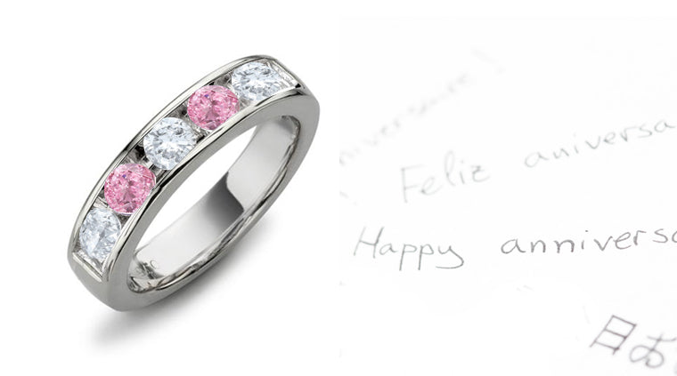 Anniversary ring alternating with 5 round pink and white diamonds