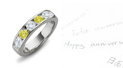 Anniversary ring with alternating 5 round yellow and white diamonds