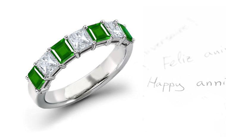 anniversary ring three stone with seven square emeralds and diamonds