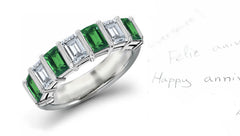 anniversary ring bar set with seven emerald cut emeralds and diamonds