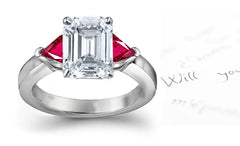 engagement ring three stone with emerald cut diamond and trillion ruby sides