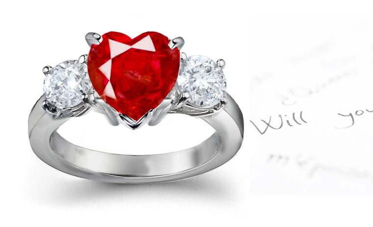 engagement ring three stone with heart ruby center and side round diamonds