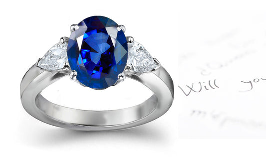 engagement ring three stone with oval blue sapphire and side pear diamonds