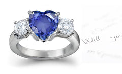 engagement ring three stone with heart blue sapphire center and side round diamonds