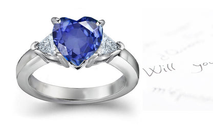 engagement ring three stone with heart blue sapphire center and side trillion diamonds