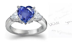 engagement ring three stone with heart blue sapphire center and side pear diamonds