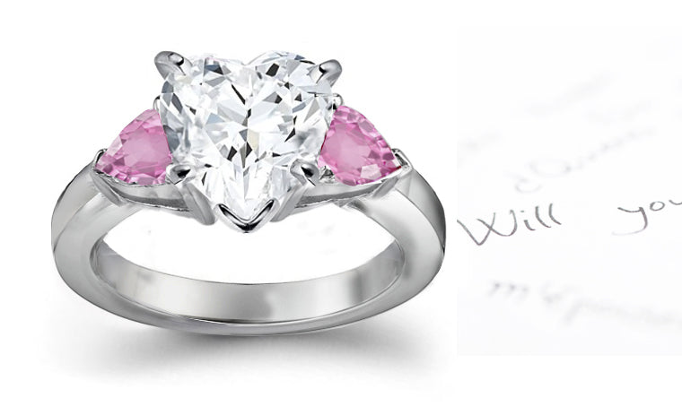 engagement ring three stone with heart diamond center and side pear pink sapphires